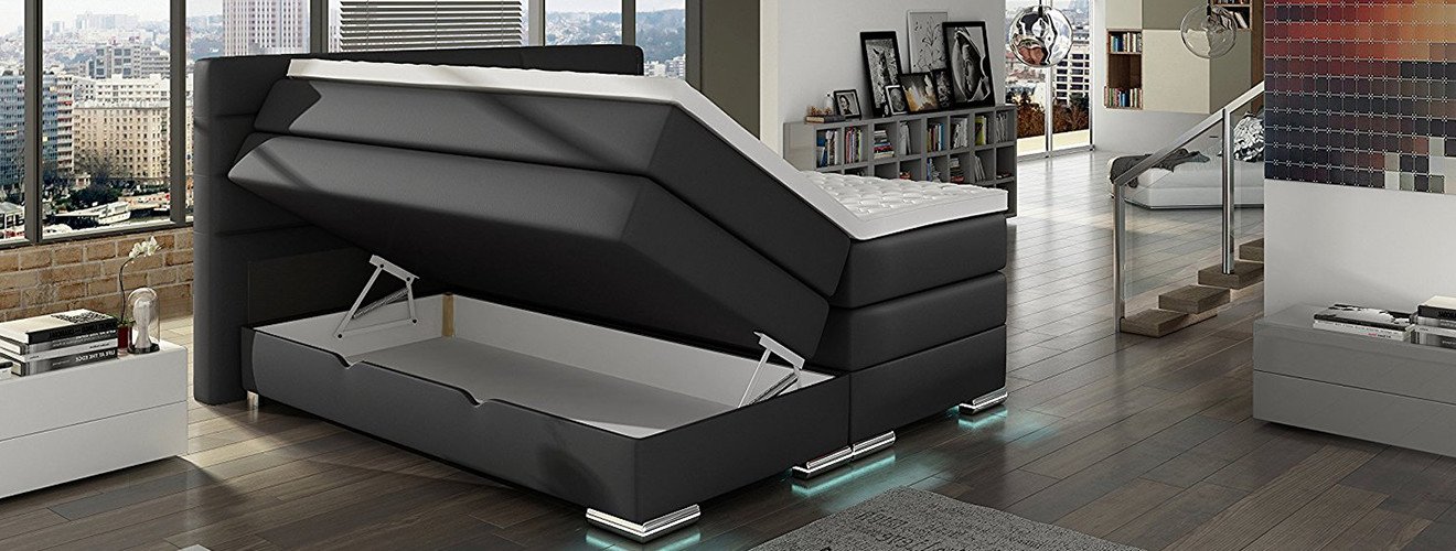 Boxspringbett mit Bettkasten in moderner Suite